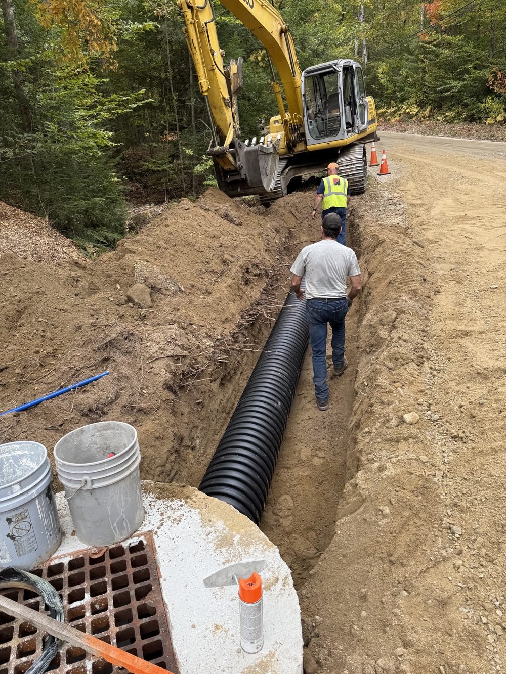 Pipe trench excavation on a Granite State Site Services job site